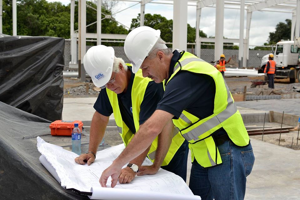 Allied Steel Buildings employees on jobsite conducting general compliance inspections